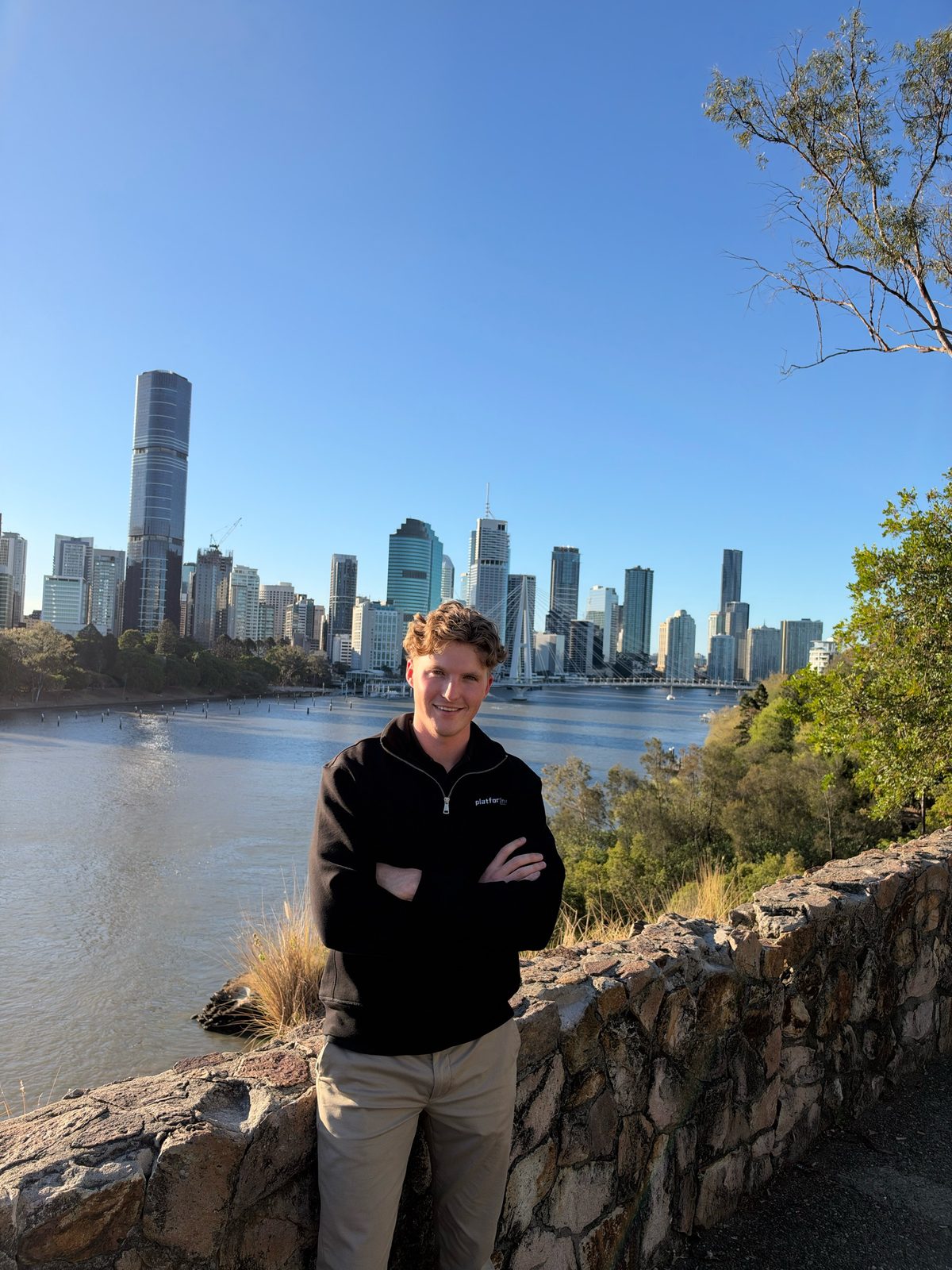 Lachlan Kosanic at a lookout above the Brisbane River